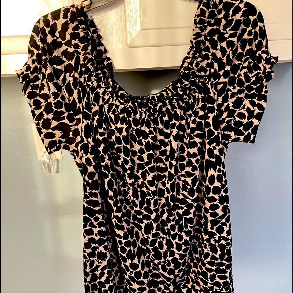 Cute off the shoulder animal print top . Bought last year never wore it .